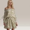 Woman in Floral dress_design by Walter Baker_Fashion Designer_Distract TV Fashion
