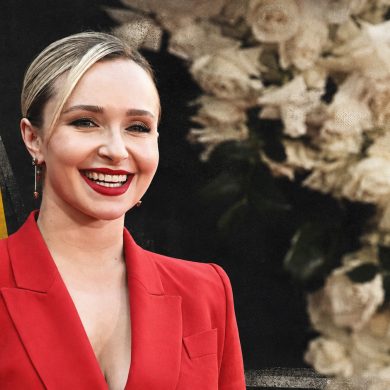 Hayden Panettiere smiling in a red suit at a red-carpet event