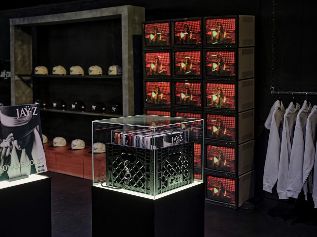 Archive-style displays and merchandise inside the JAY-Z 30 London pop-up in Camden
