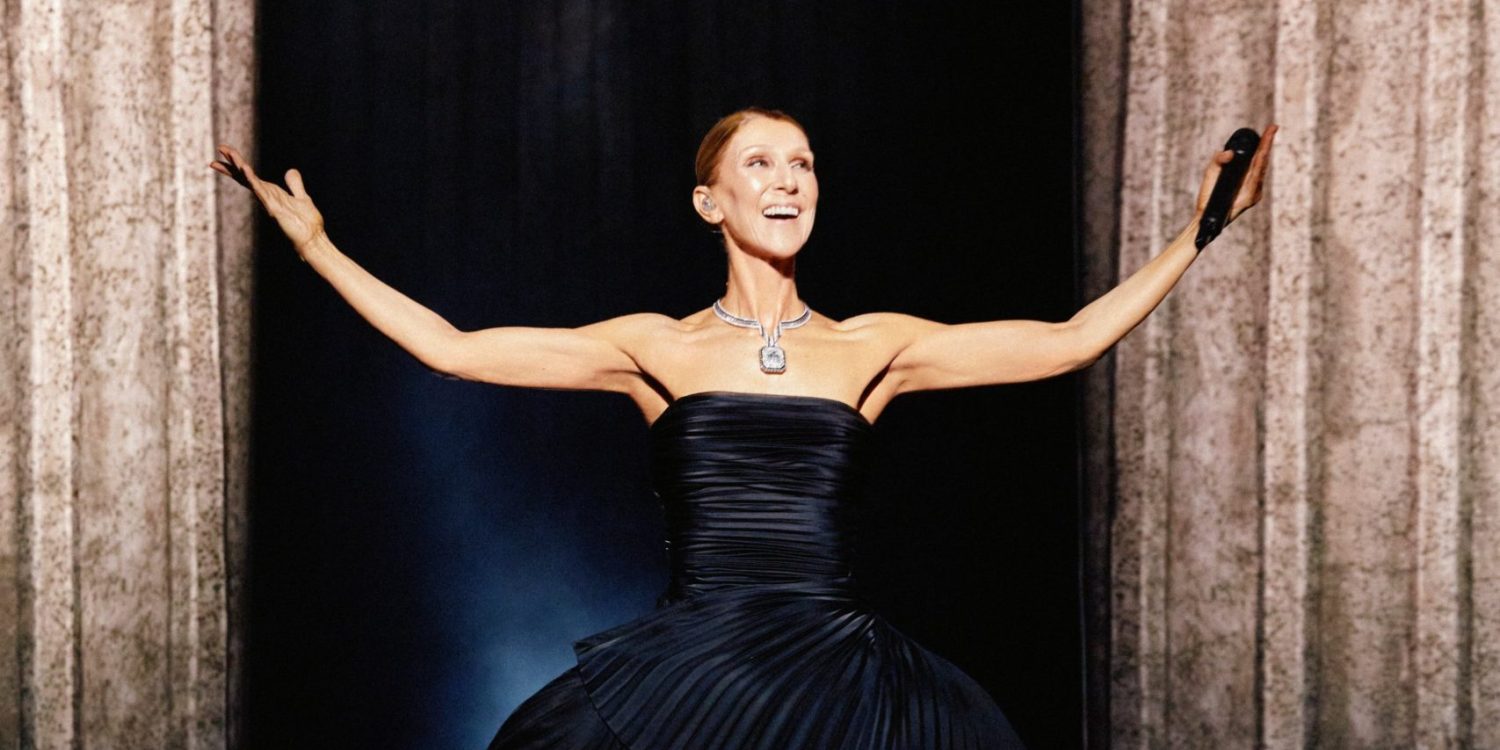 Céline Dion opens her arms to the audience during her Paris 2026 comeback concert