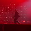 JAY-Z performing during JAY-Z 30 London at Tottenham Hotspur Stadium under red stage lighting