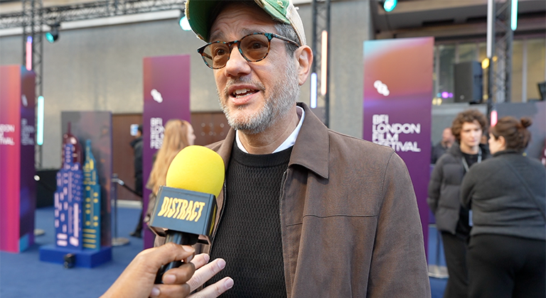 Michael Giacchino speaking into a Distract microphone during an exclusive red-carpet interview at the Ray Gunn premiere, BFI London Film Festival 2026.