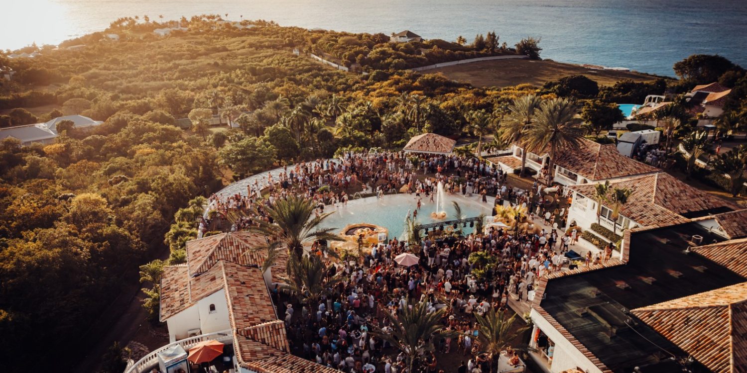 Aerial view of SXM Festival 2026 villa pool party overlooking the Caribbean Sea in St. Martin