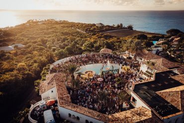 Aerial view of SXM Festival 2026 villa pool party overlooking the Caribbean Sea in St. Martin