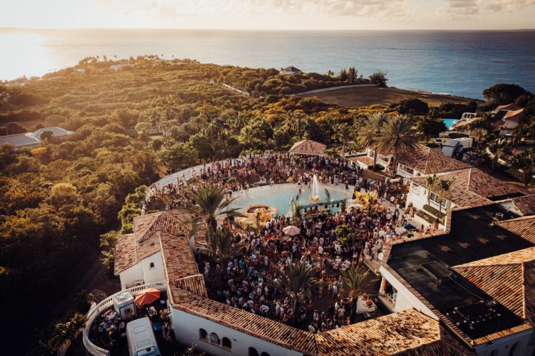 Aerial view of SXM Festival 2026 villa pool party overlooking the Caribbean Sea in St. Martin